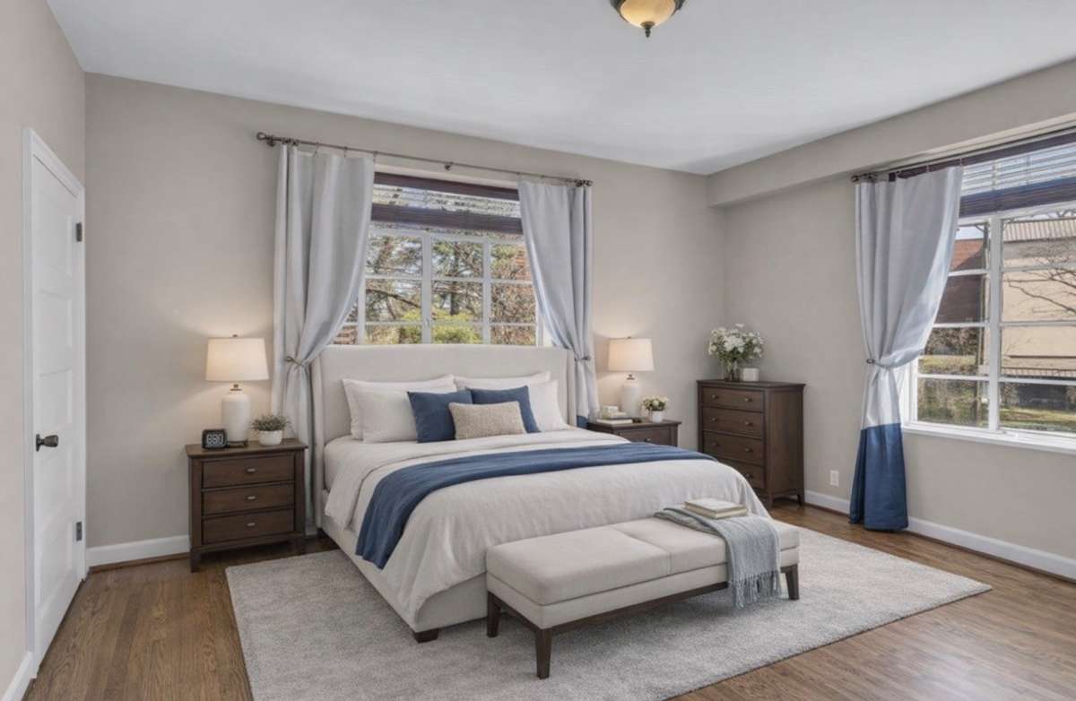 Primary bedroom (virtually staged) is spacious and flexible.