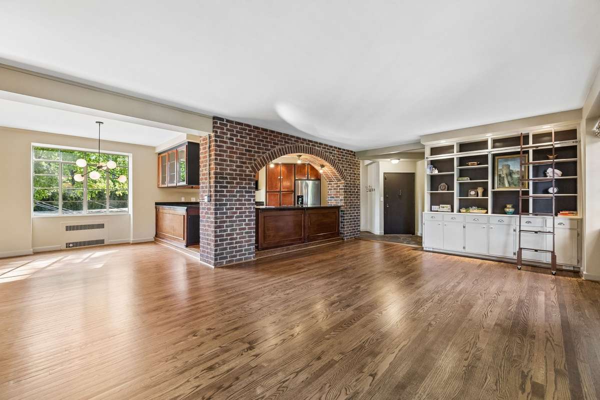The standout feature is the exposed brick accent walls, which adds depth, texture, and a hint of historic character.