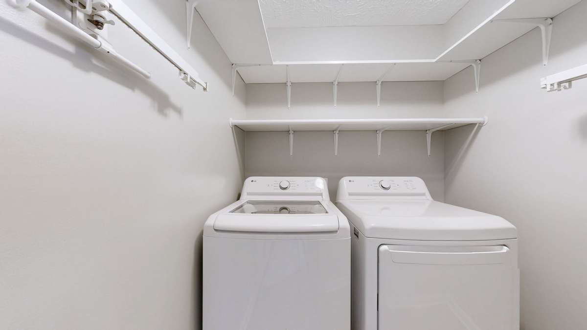 Laundry room with added shelving - washer and dryer will remain!