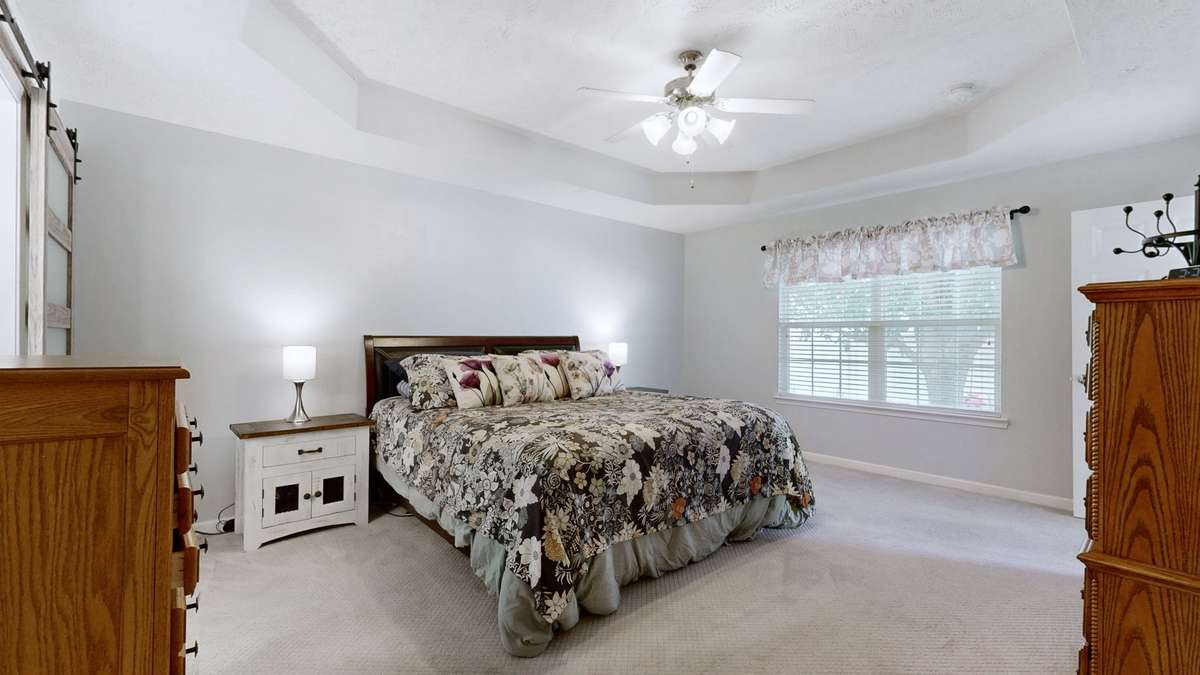 Another view of the primary suite - lots of natural light!