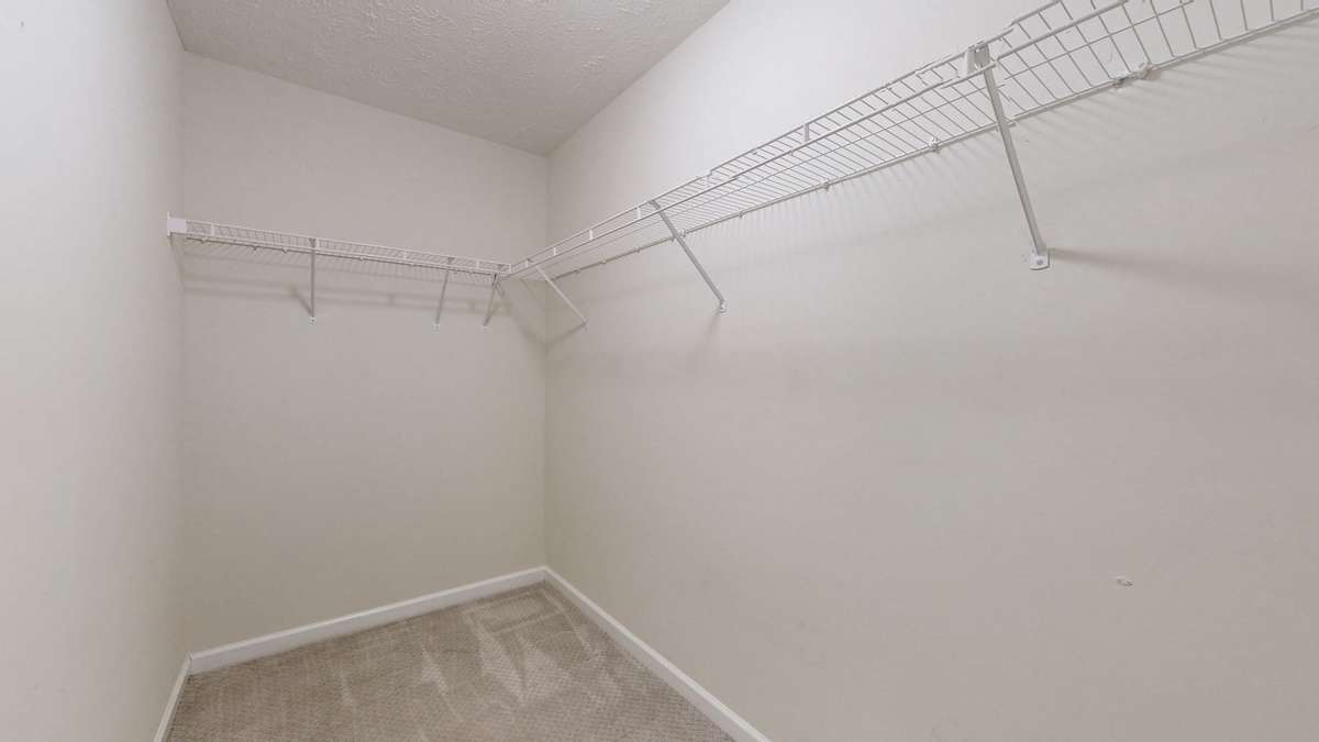 Large walk-in primary closet.