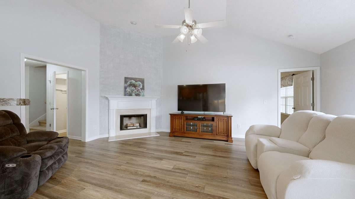 Open Living Room with Wood Burning Fireplace