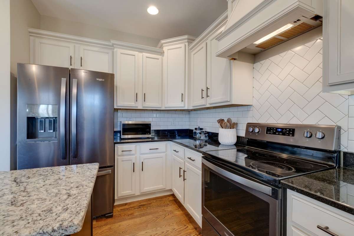 UPGRADED Stainless Steel Appliance Package including Refrigerator
Tile Backsplash