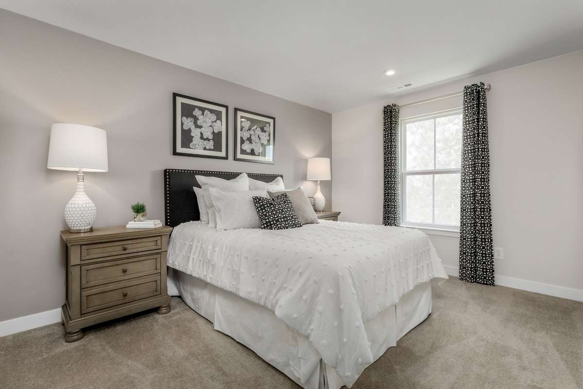 ALL photos are of a model home - One of two secondary bedrooms