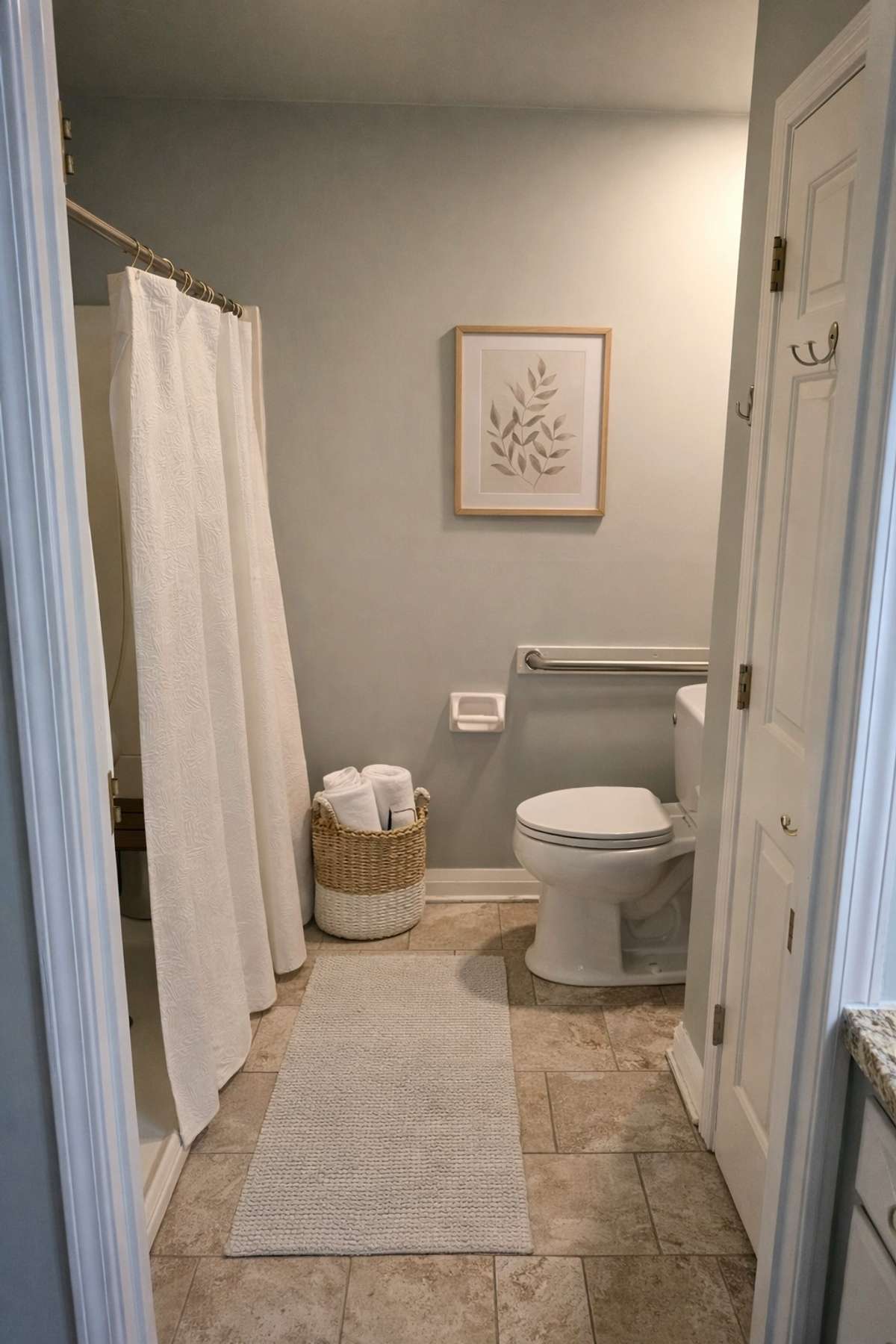 Primary bathroom. Shower & toilet area.
