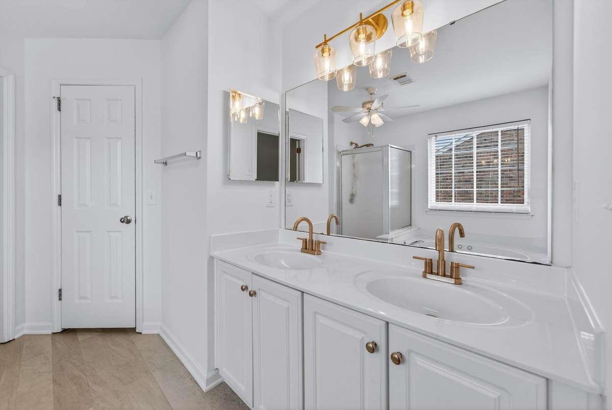 Updated light fixture and new faucets.