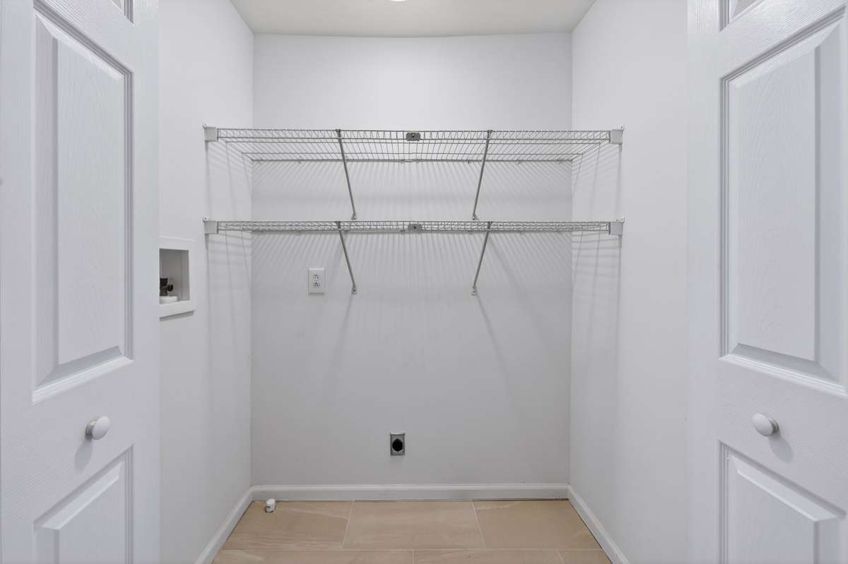 Laundry area on 2nd floor with new tile floor.