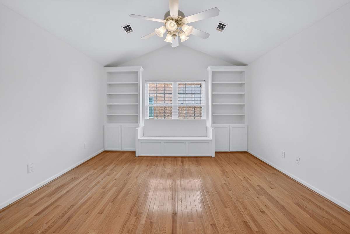 What a great bonus room!  the bench has storage in it and the built-in bookcases are an added feature.