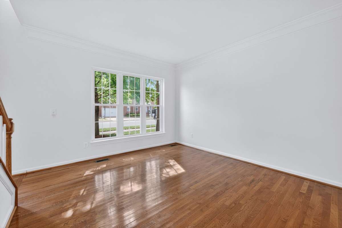 The formal living room with triple windows.
