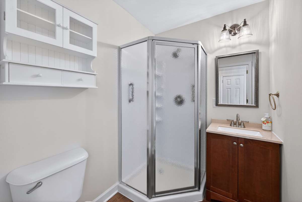 The first floor full bath. A great upgrade from a powder room. This is adjacent to the possible 5th bedroom option.