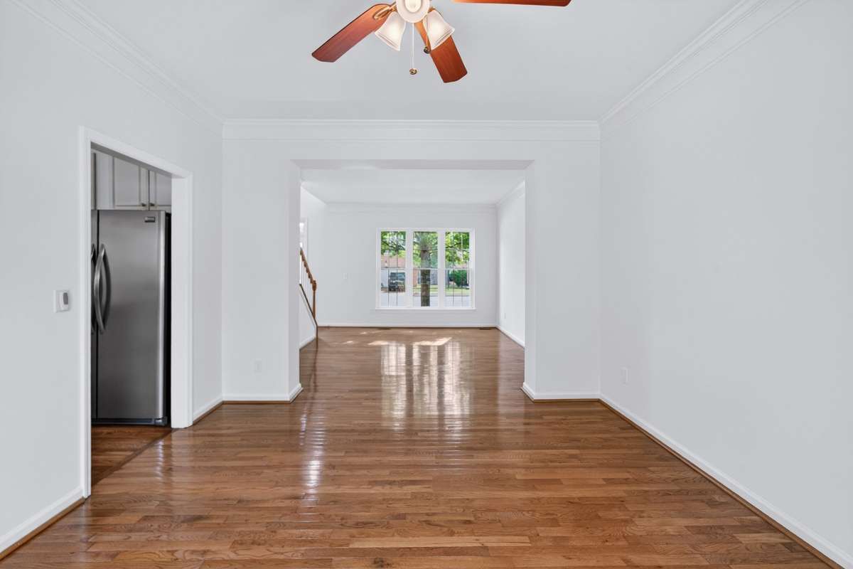 View from the formal dining room to the living room.  The kitchen is to the left.