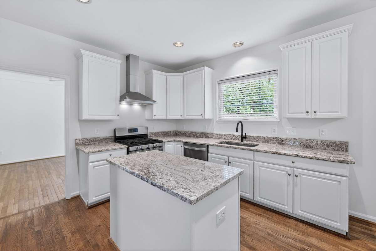 There is an abundance of storage space both here and adjacent to the refrigerator.