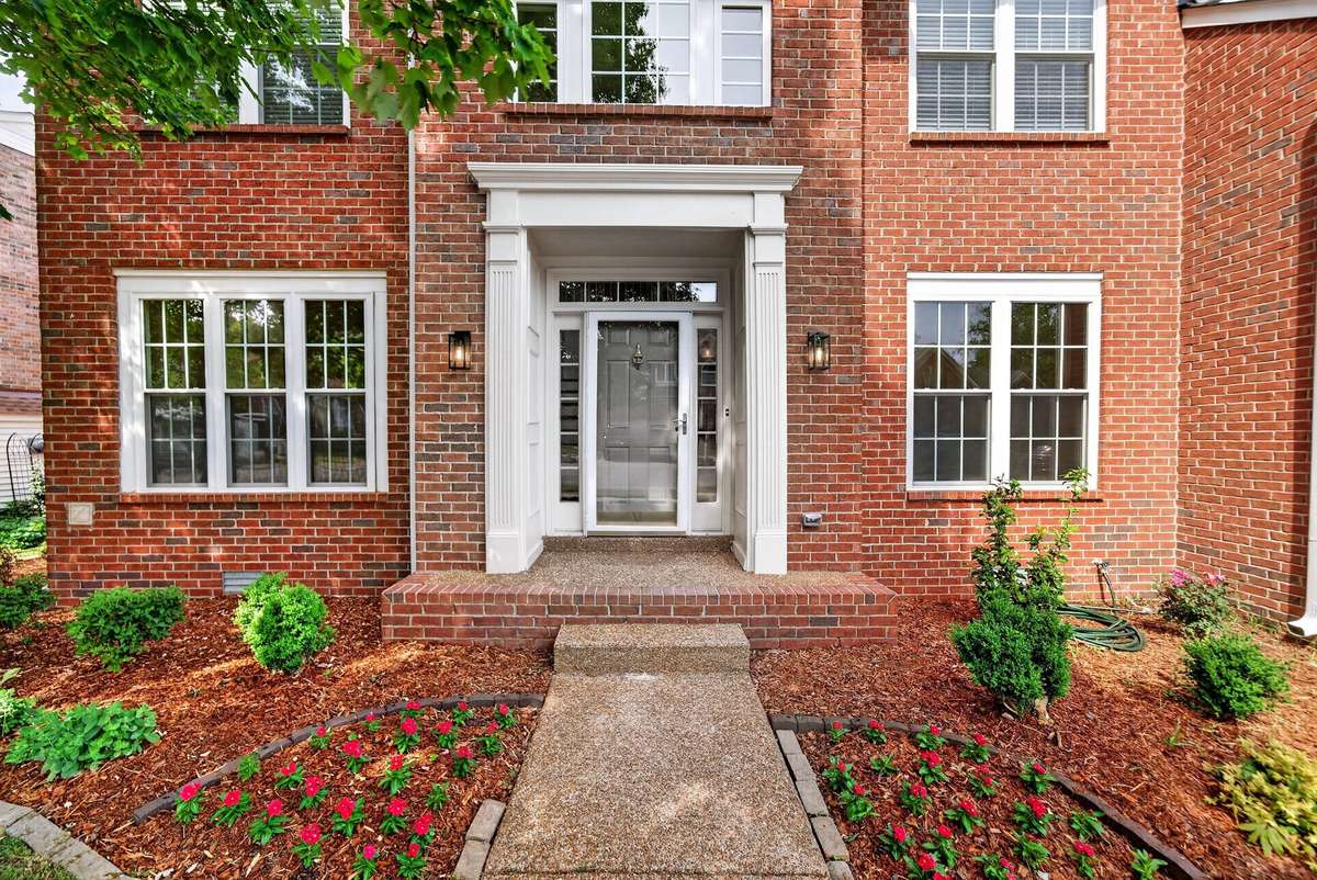 The inviting front entrance is freshly landscaped.