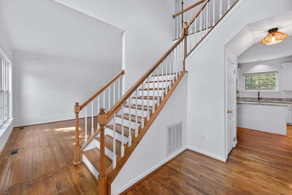 The entrance is open and airy.  Hardwood floors are found throughout the main level. The entire interior has been newly painted.