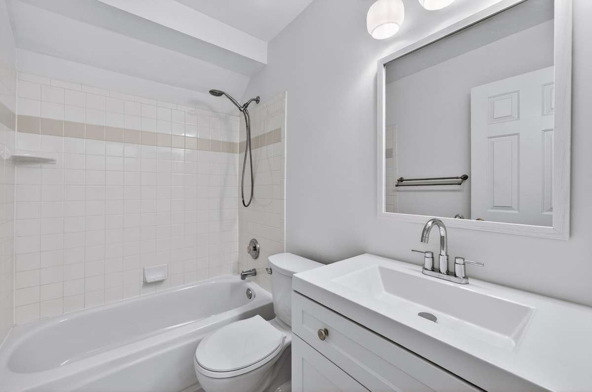 The secondary bath upstairs has new floor installed, updated plumbing fixtures and the ceramic tile is spotless!