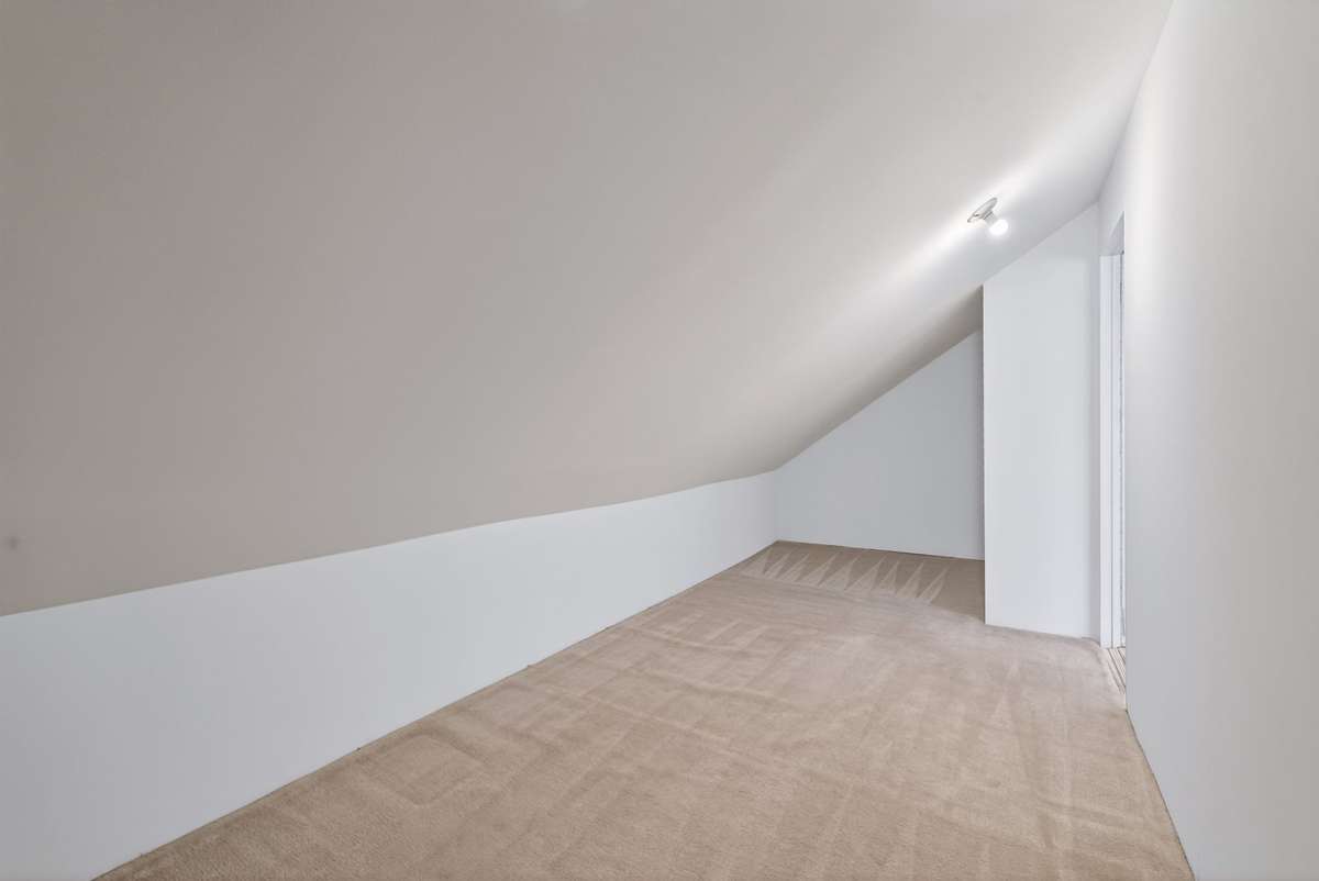 This is the additional room off the Bonus Room.  What a great area for desks, storage or whatever your creative mind thinks!
