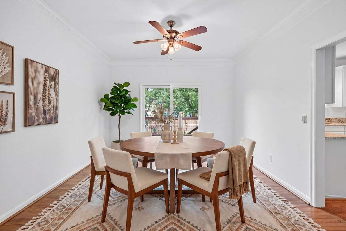 Dining room looks over and opens up to the deck. (Virtually staged)