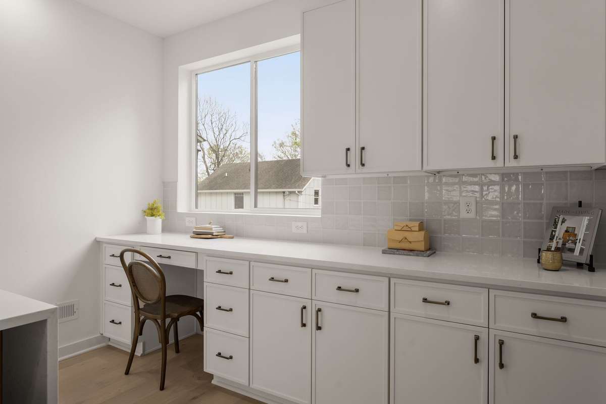 Built in desk and abundant cabinetry in the kitchen