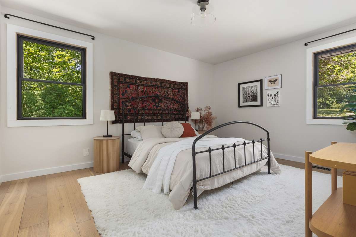primary bedroom with a walk-in closet