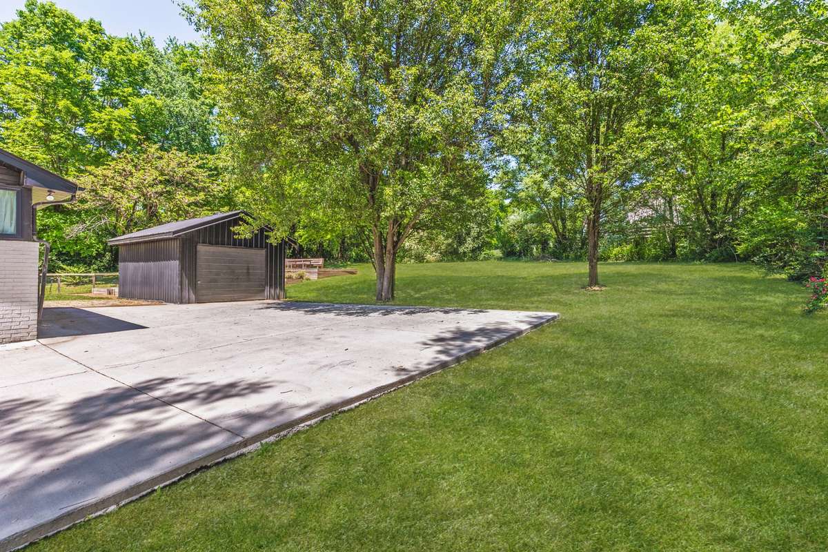 detached garage shed that could be a workshop or converted to a studio, home gym, etc.