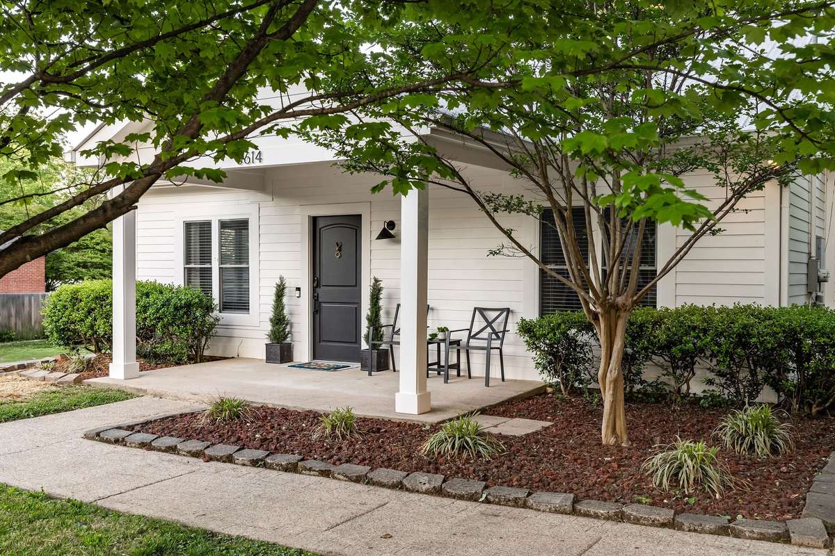 This covered porch is begging for your porch swing