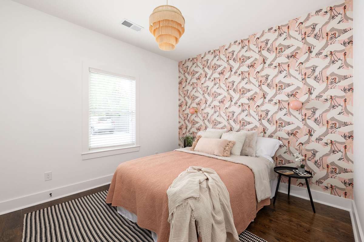 Gorgeous crane wallpaper adorns these walls.