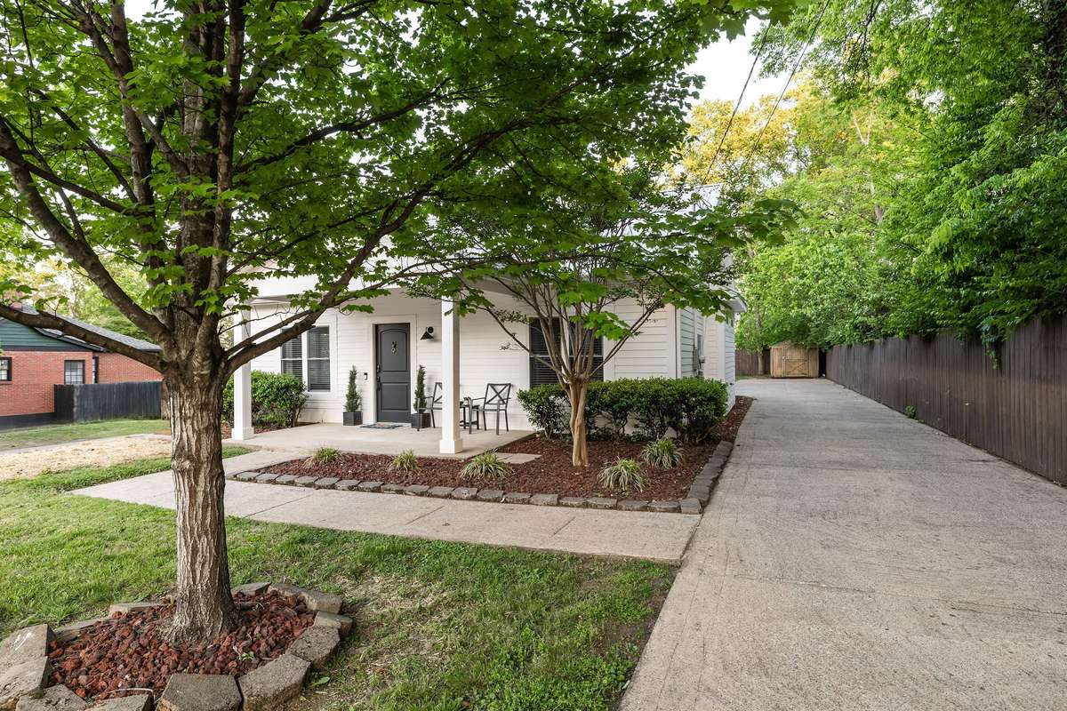 Long driveway with parking pad--perfect for guests or renters. Street parking is on the other side of the home.