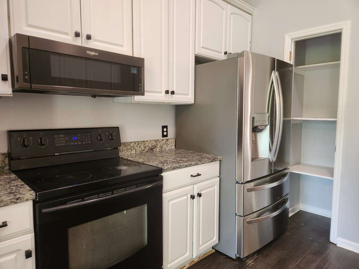 All appliances included, needs fresh paint and pantry door. Granite is in perfect condition