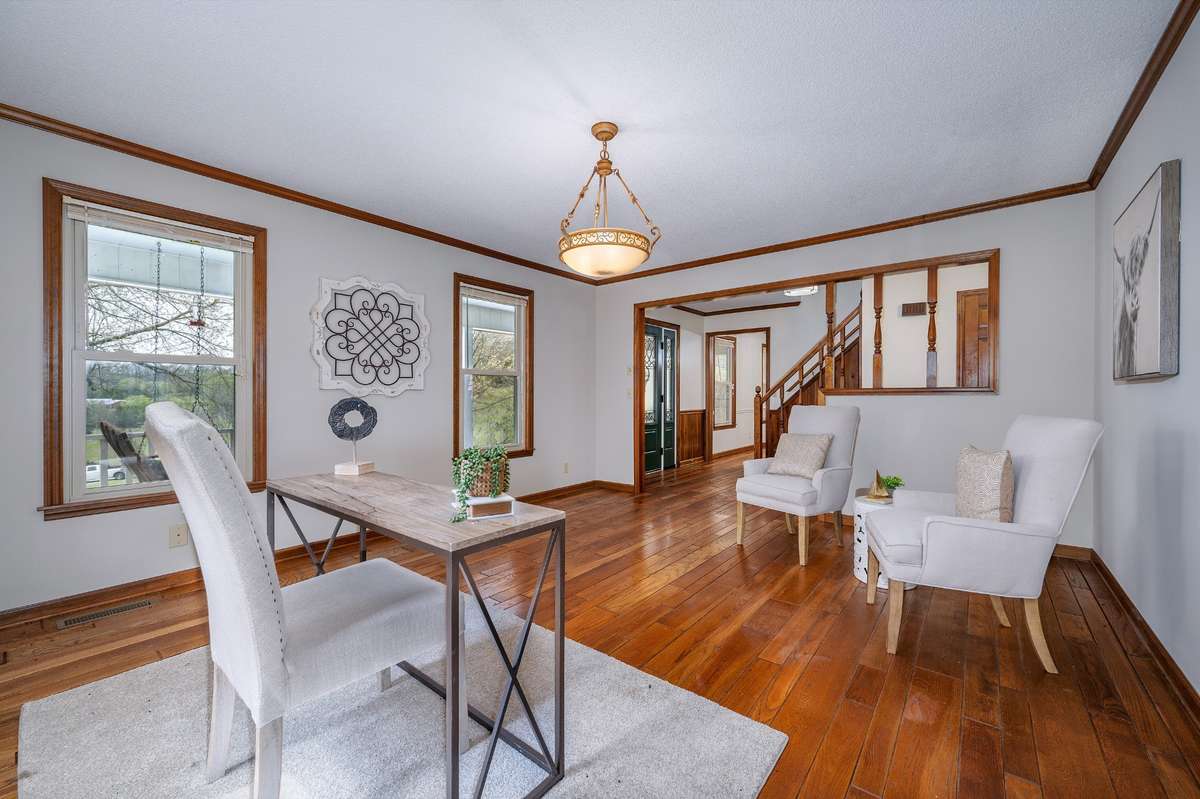 The large room to the right of entry can be used as a formal living room, office, or flex space