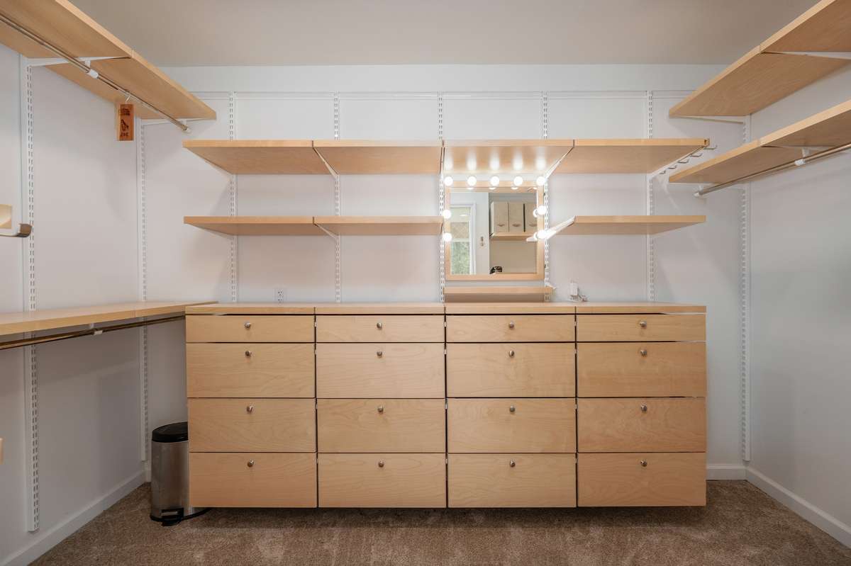 Primary closet on main level with Elfa Closet System