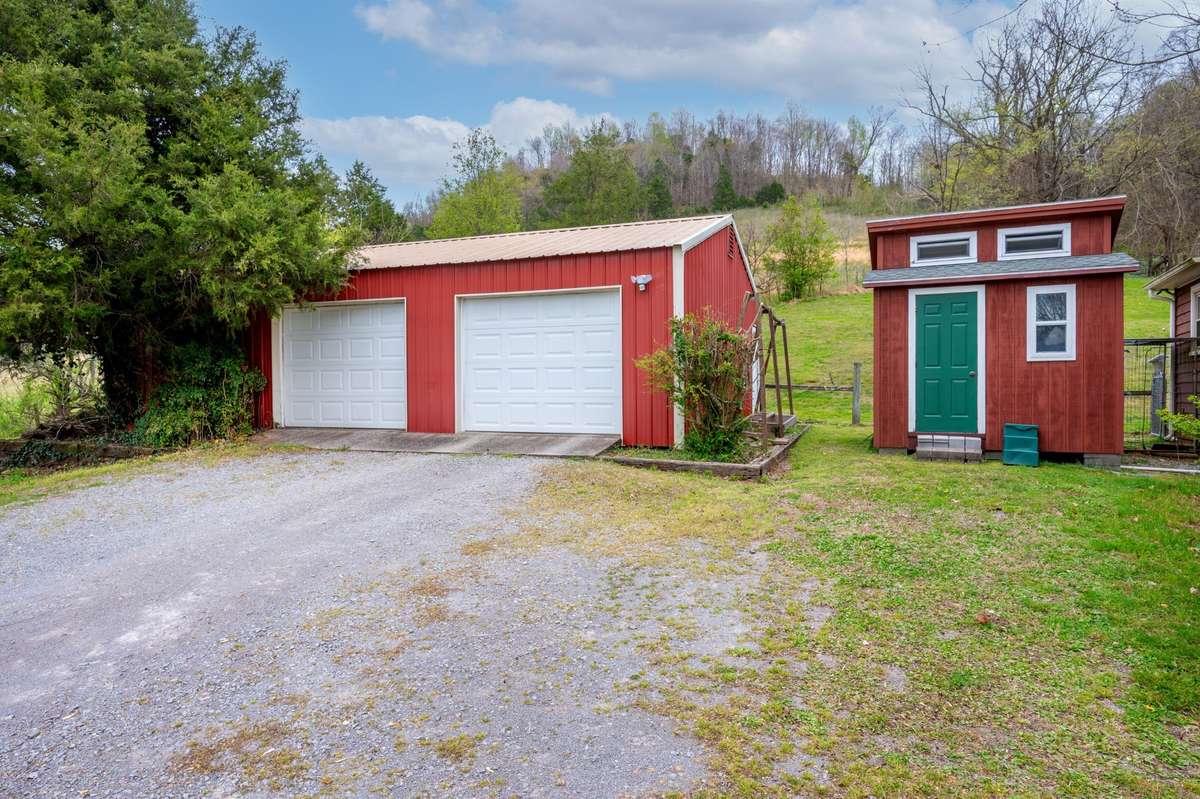 Detached 2-car garage/workshop with custom chicken chateau