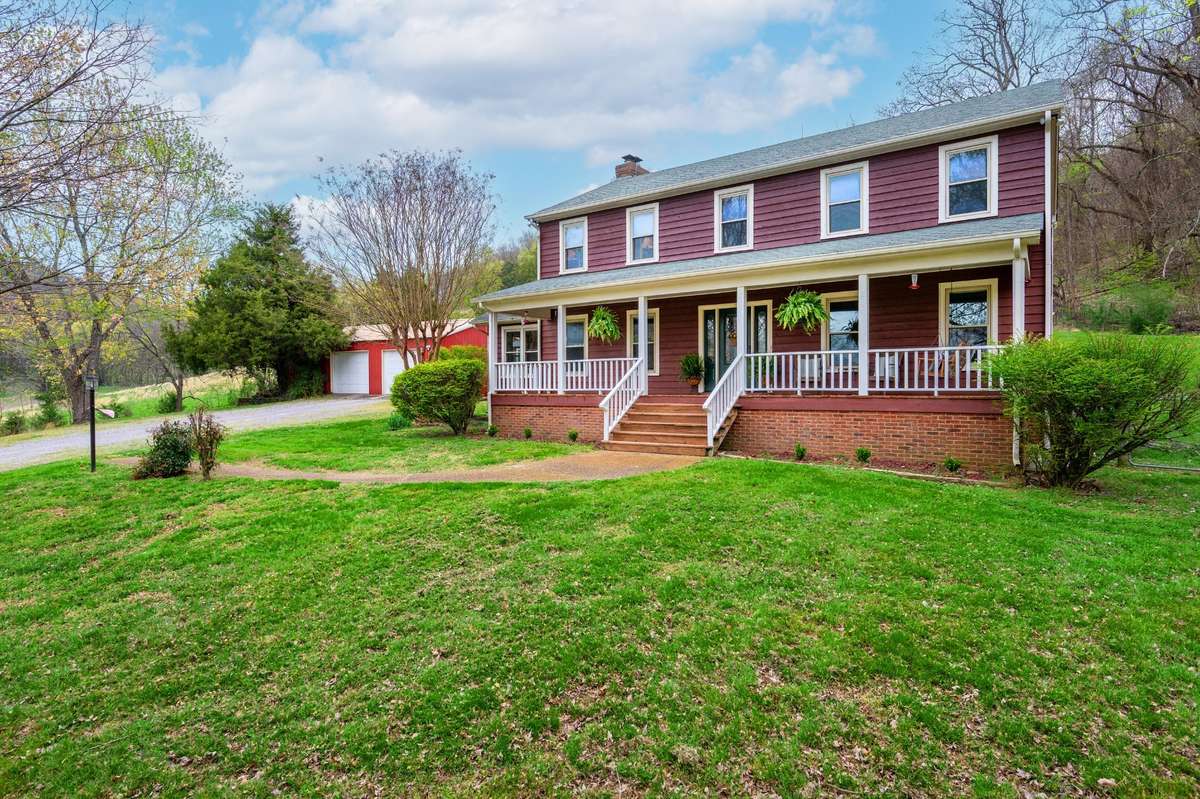 This picturesque cedar-sided home is nestled on 31 acres in beautiful Bell Buckle, TN