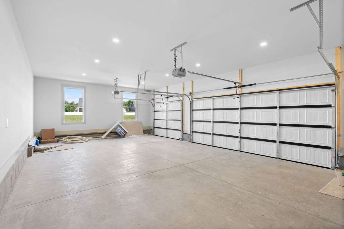 Oversized 3 car garage. Fits full size vehicles.