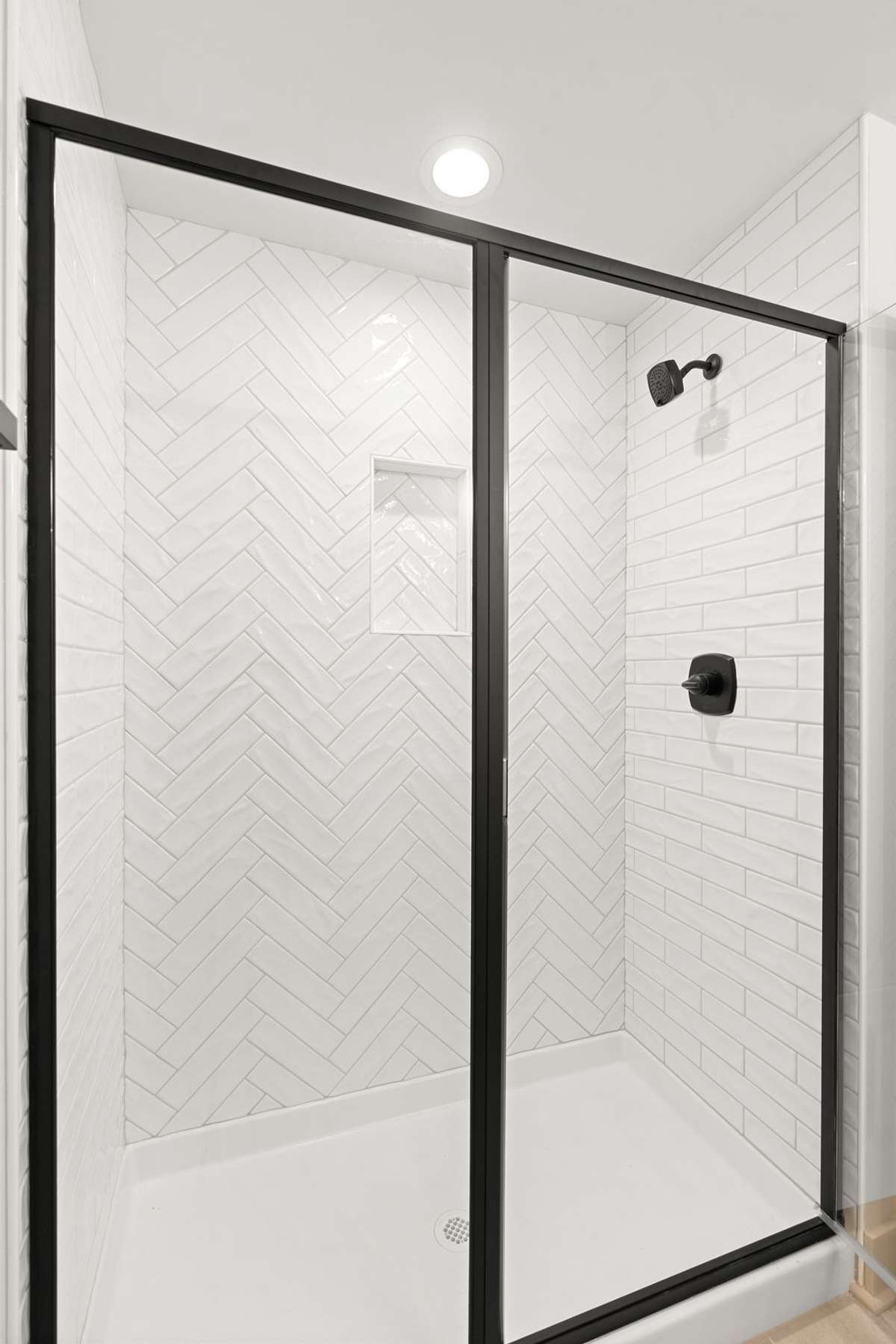 Another bathroom upstairs with walk in shower and custom tile work.