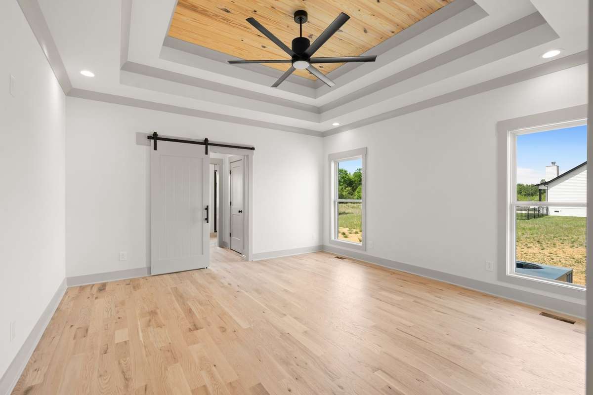 Large primary bedroom. Gorgeous wood ceilings.