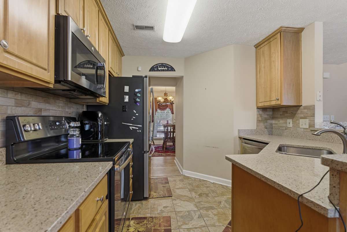 The quartz countertop perfect accent to already well appointed color scheme.