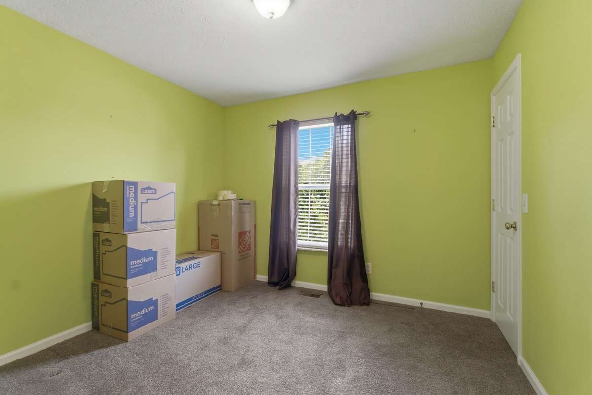 3rd bedroom with walk in closet. Please excuse our boxes as we get ready for the new owner.