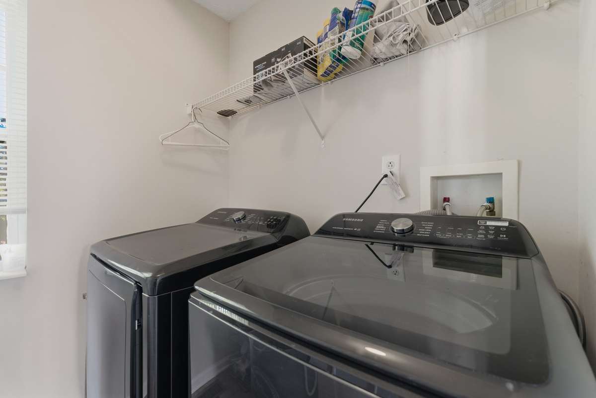 Laundry room located in a great spot to add to your productivity when doing laundry