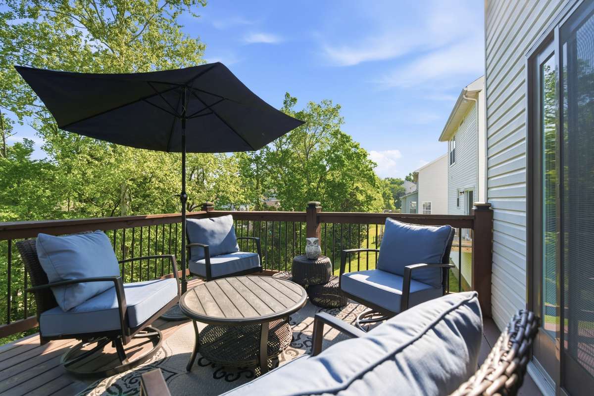 Come soak up some sun on this nice patio deck that overlooks the the beautiful backyard.