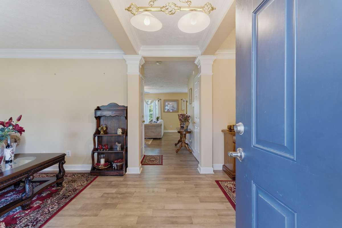 Hardwood flooring and inviting neutral colors say "Welcome"