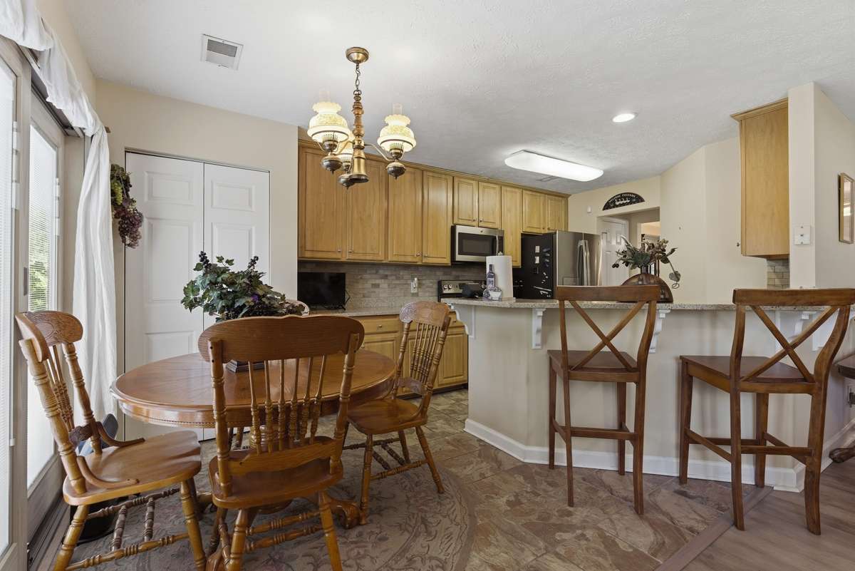 Beautiful ceramic tile floors adorns the kitchen and breakfast area with a pantry.