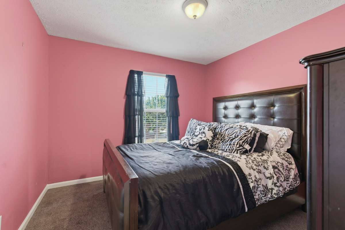 2nd Bedroom allows the light to shine in. Spacious bedroom with a walk in