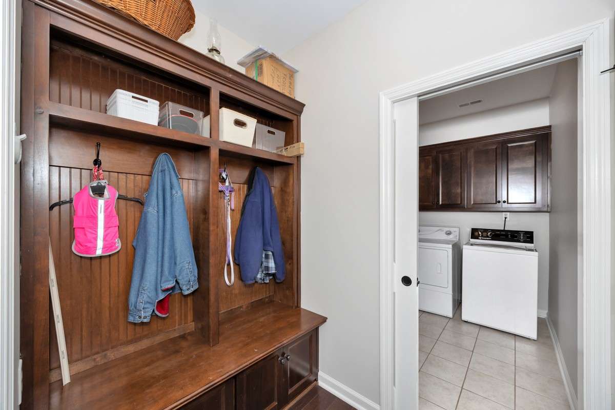 Custom Drop Station - Custom cabinetry, in entry from garage- drop station for shoes, coats, etc.
