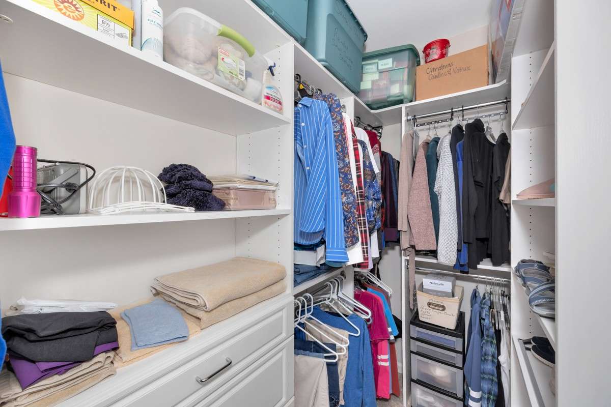 Walk in closet- large walk - in closet, photo does not show entire closet
