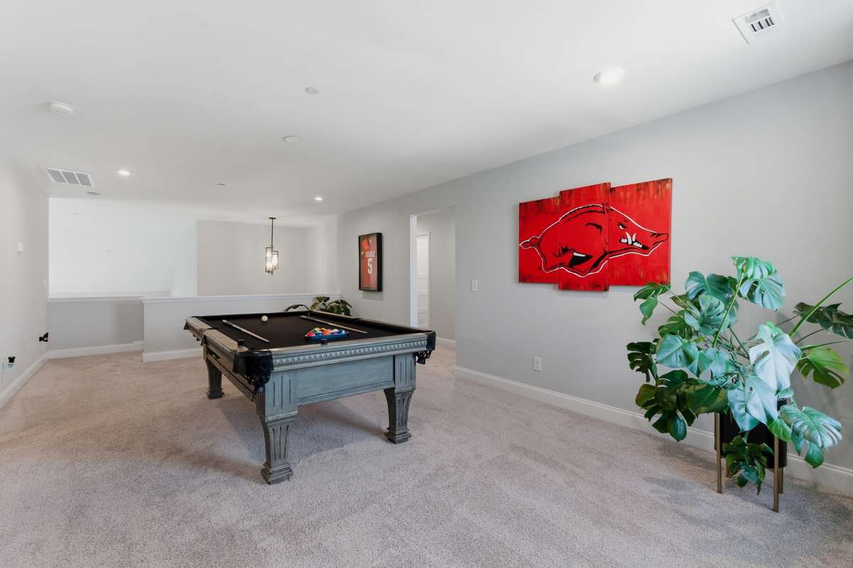 The open layout provides plenty of room for a media area, game table, or flexible lounge setup.