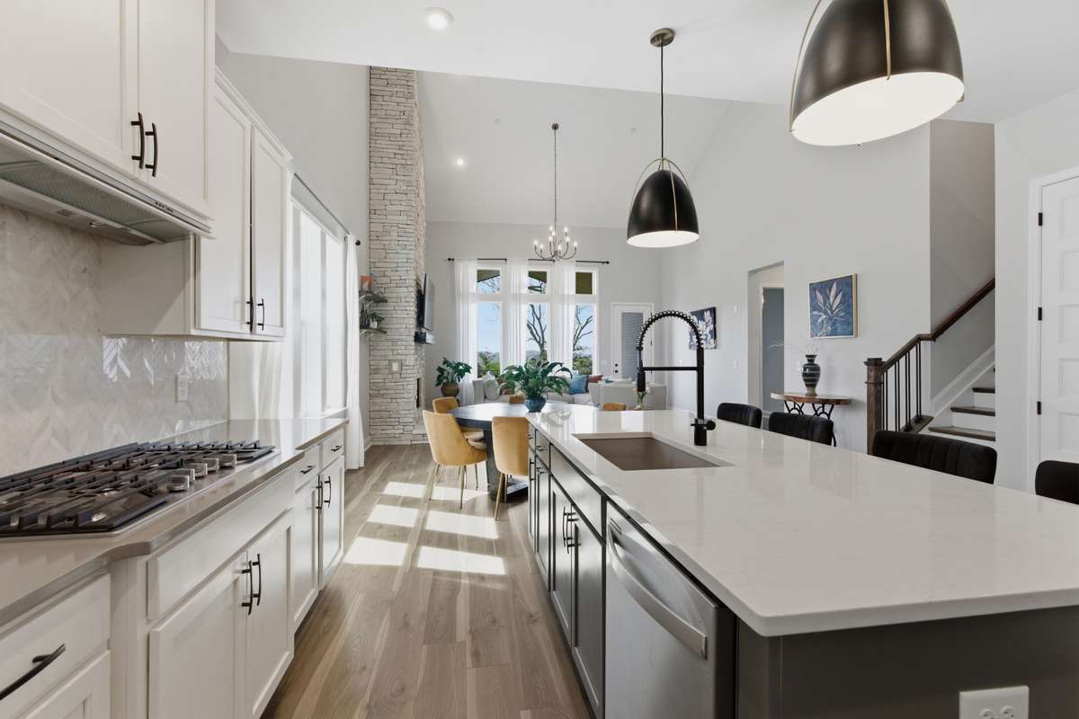 Quartz countertops with plenty of prep space throughout.