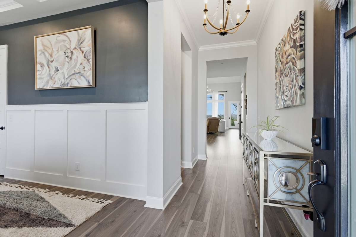 Step inside to a defined foyer with custom trim work that sets the tone right away.