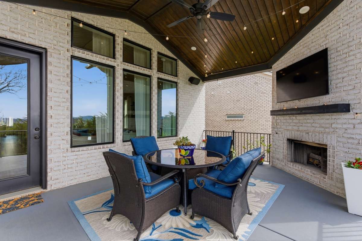 You’ve got a second fireplace out here, which makes this spot just as usable on cooler nights as it is during the warmer months.