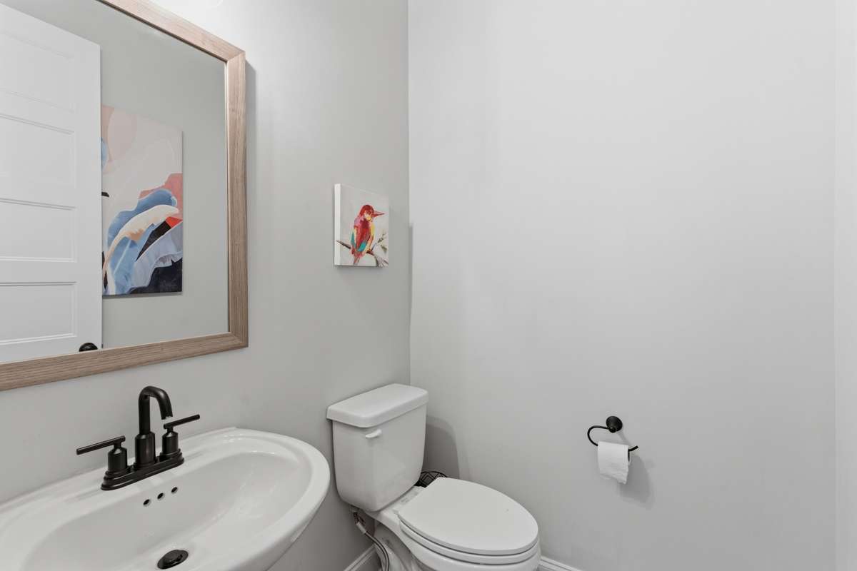 Conveniently located just off the main living area, this half bath is perfect for guests.
