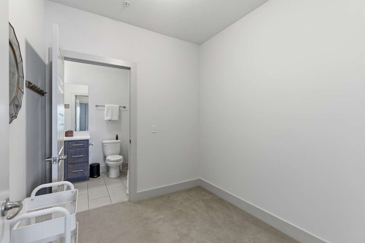 The spacious walk-through closet connects to a second full bath.